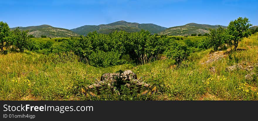 A mountains landscape in sunny day. Panorama photo.