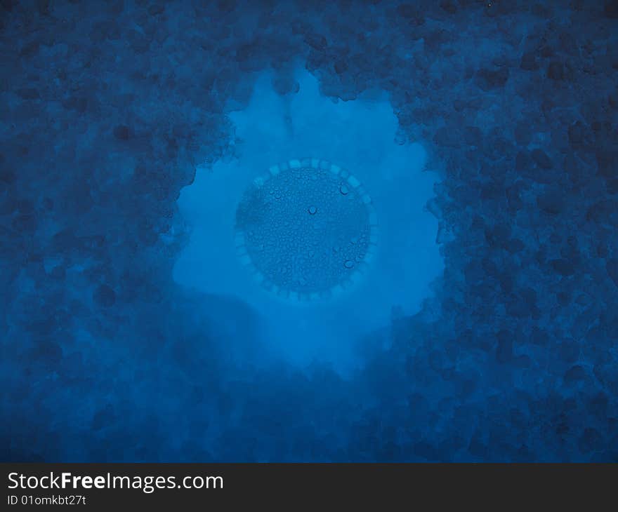 Pieces of ice lit with blue light underneath. Pieces of ice lit with blue light underneath