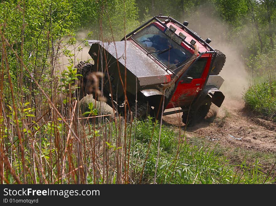 Off-road car stiring up the dust