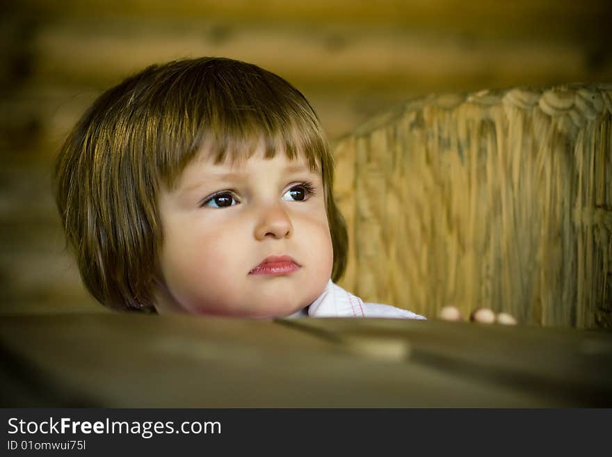 Beautiful girl on the wooden chair sitting portrait. Beautiful girl on the wooden chair sitting portrait