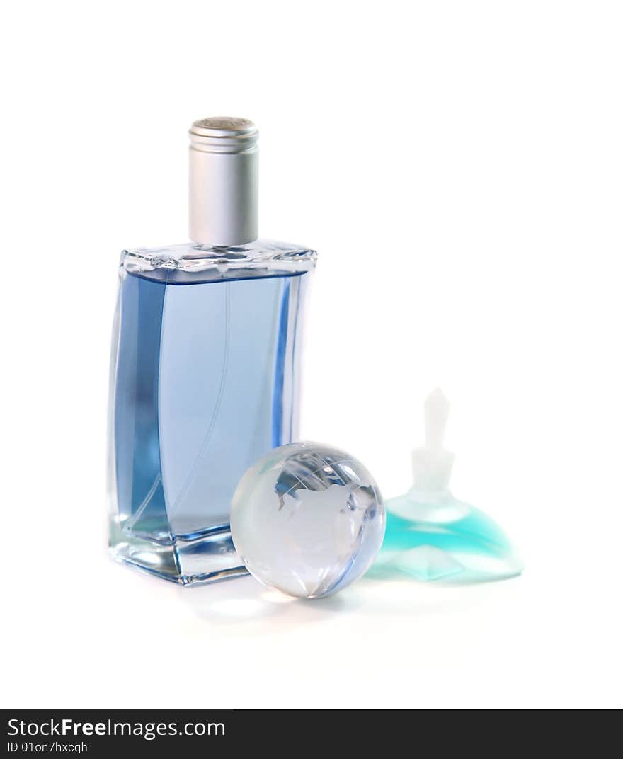 Man's both female perfume and the glass globe are isolated on a white background