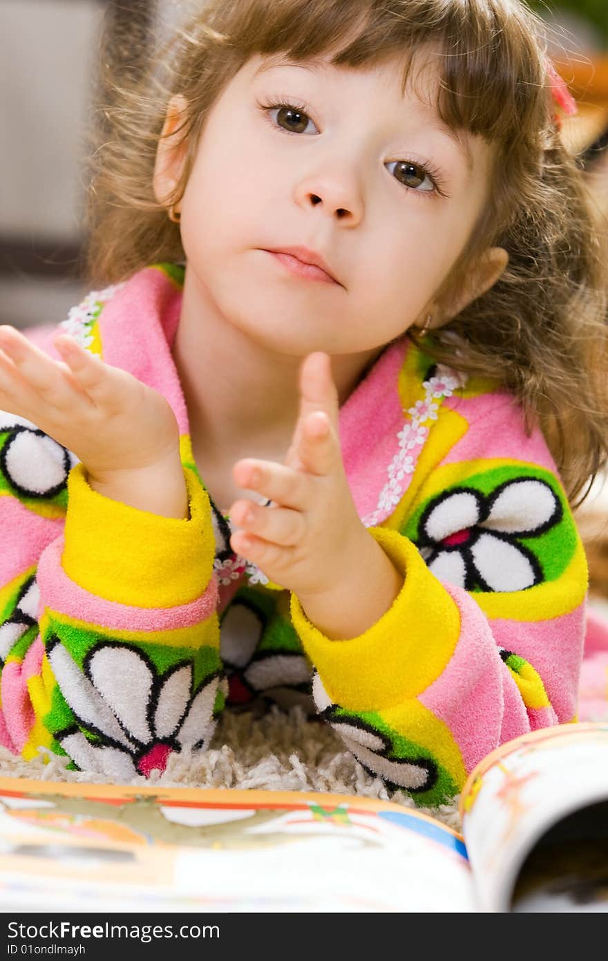 Happy little girl reading open book. Happy little girl reading open book