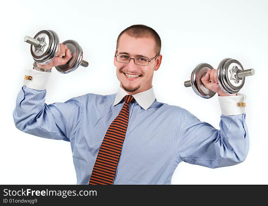 Handsome businessman exercising with dumbbells. Isolated