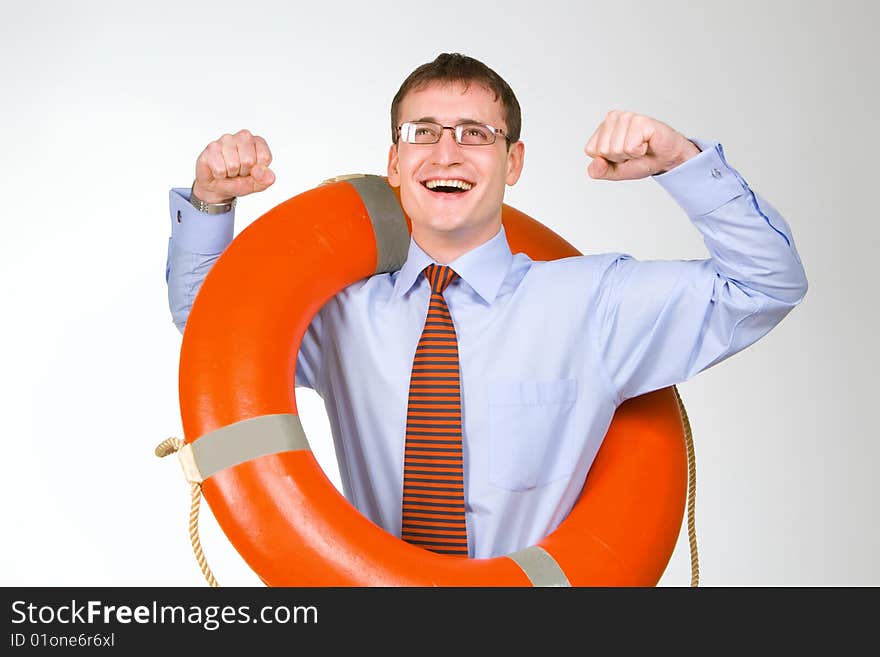 Young handsome businessman holding a life buoy