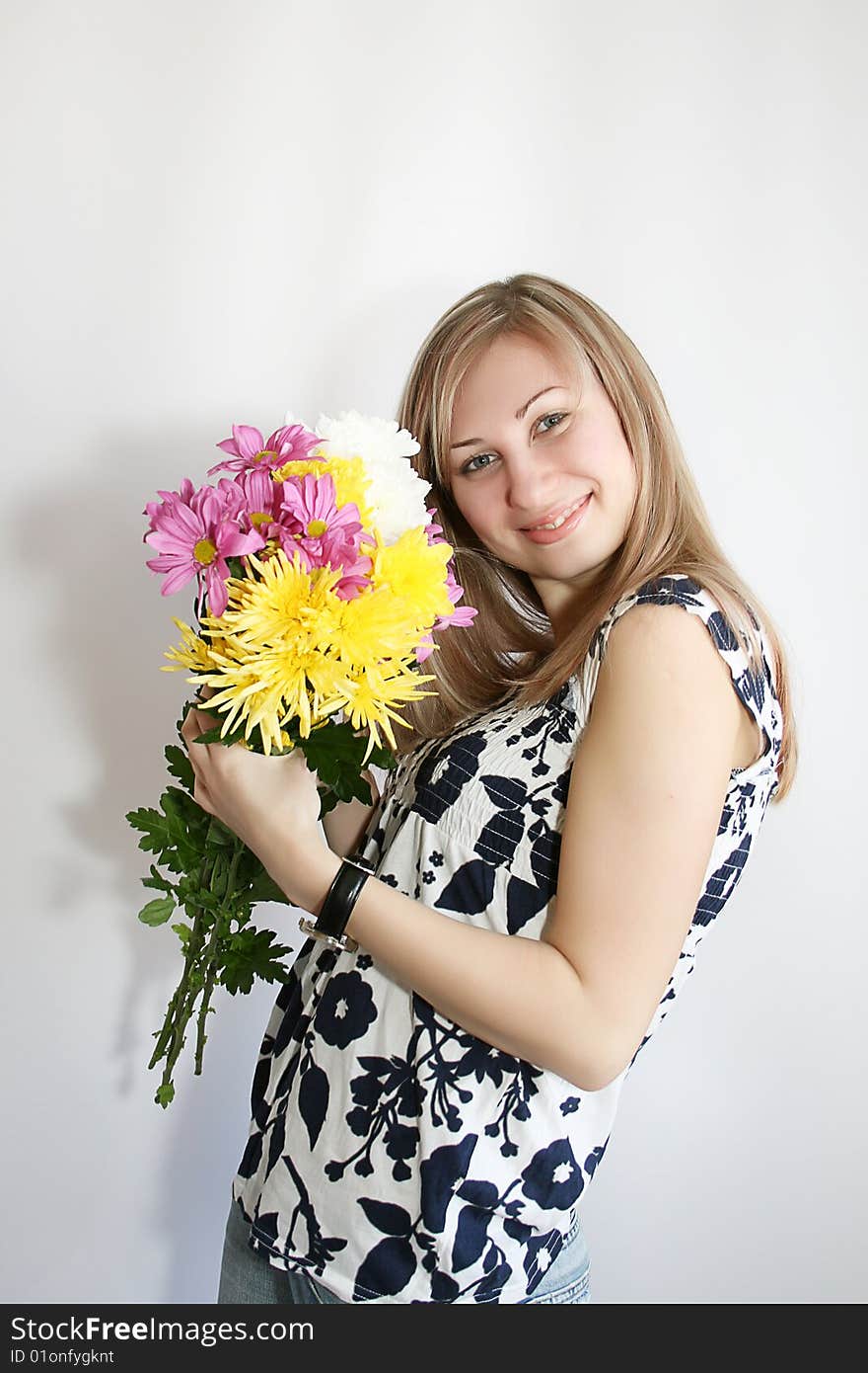 Happy young smiling woman with bunch of flowers. Happy young smiling woman with bunch of flowers