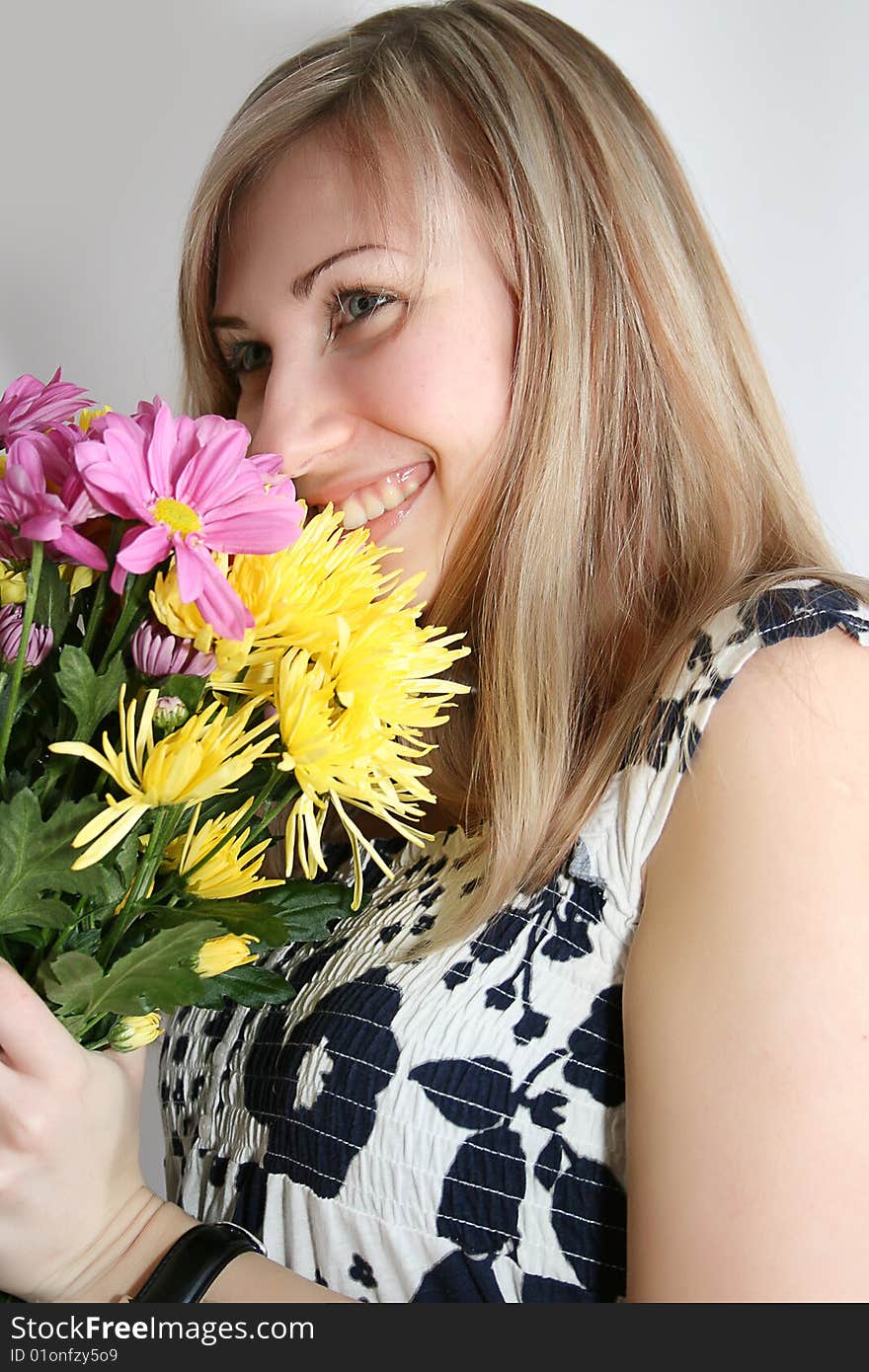 Happy young smiling woman with bunch of flowers. Happy young smiling woman with bunch of flowers