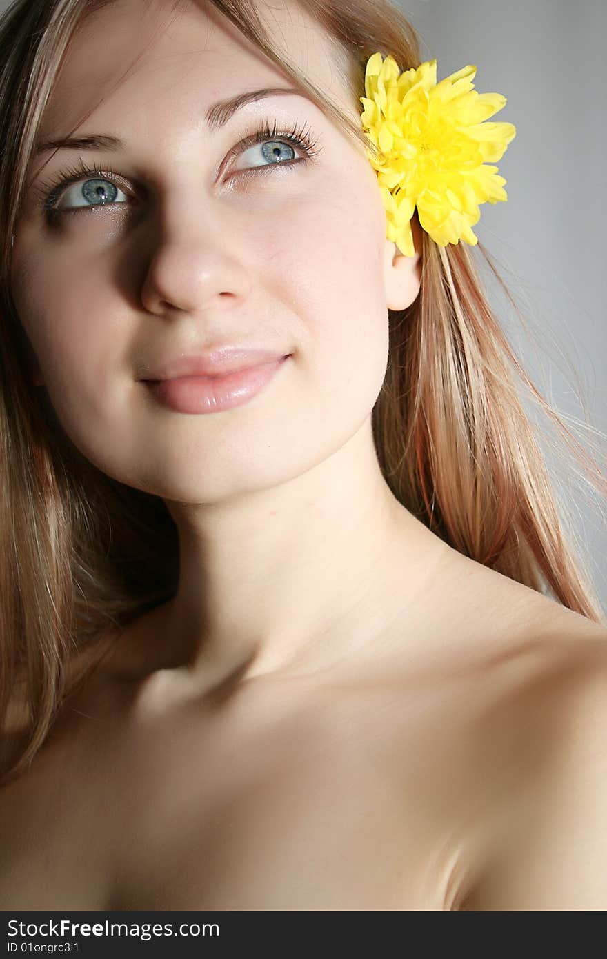 Beautiful young woman with yellow flower. Beautiful young woman with yellow flower