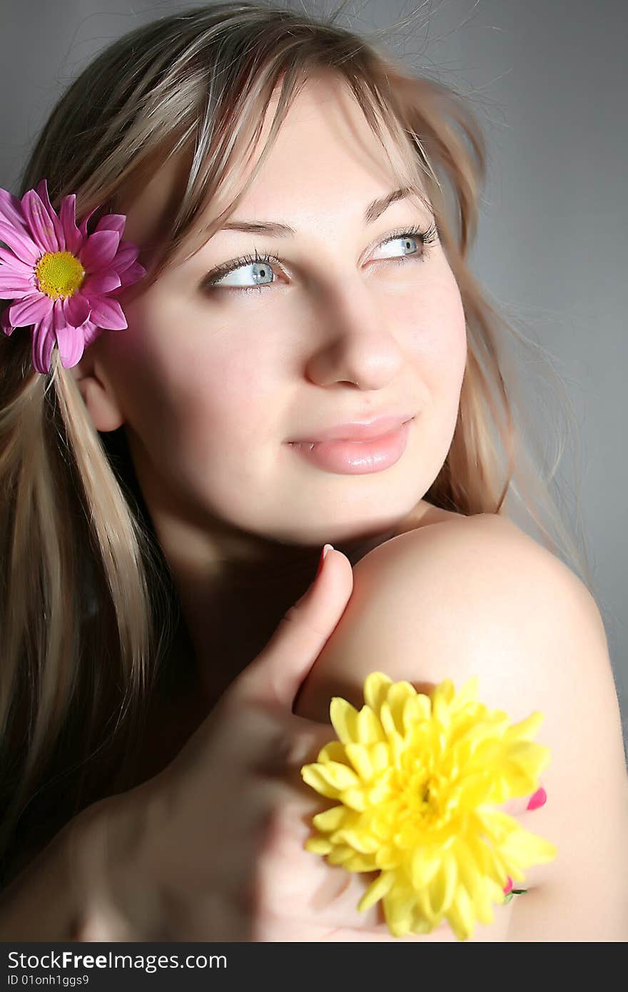 Beautiful young woman with yellow flower. Beautiful young woman with yellow flower