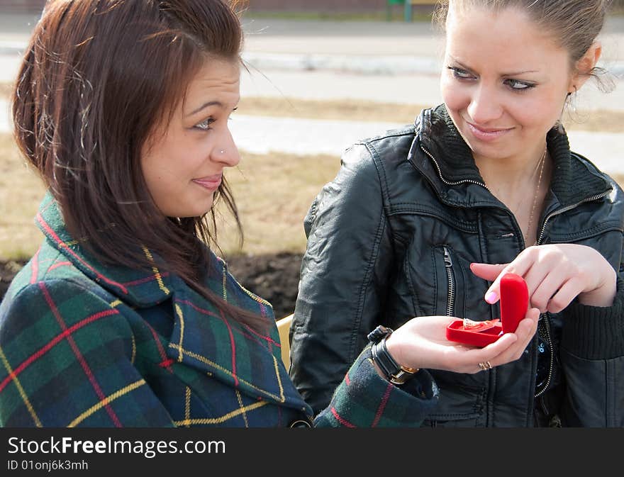 Girl Shows To Other Ring In Red Box