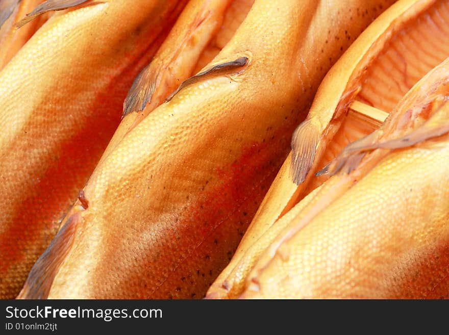 Few fresh smoked appetizing salmons. Few fresh smoked appetizing salmons