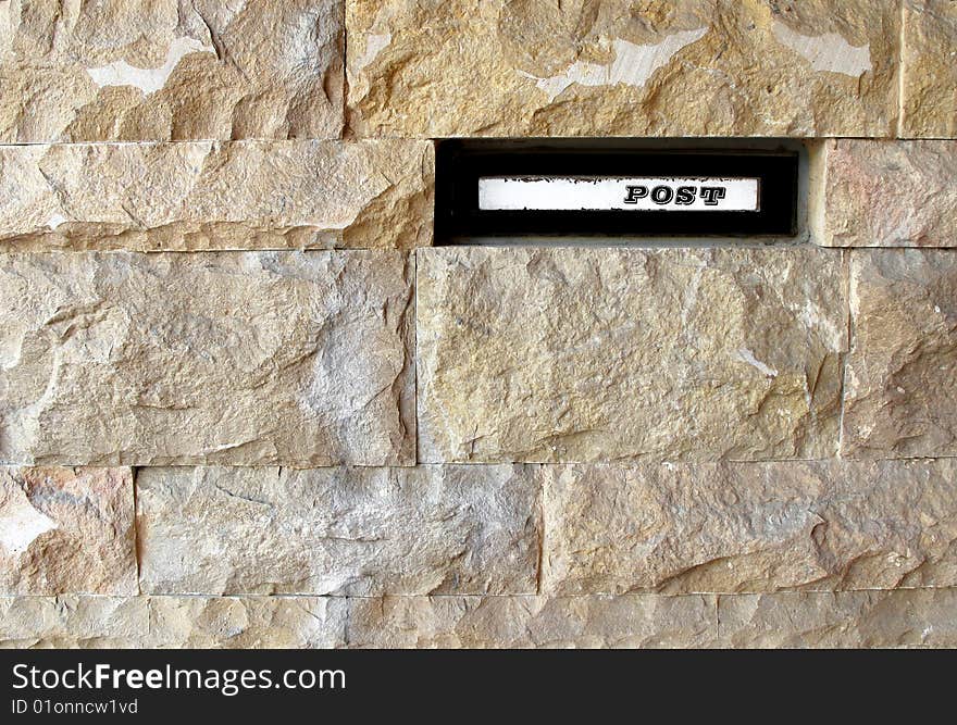 Letterbox in house stone wall