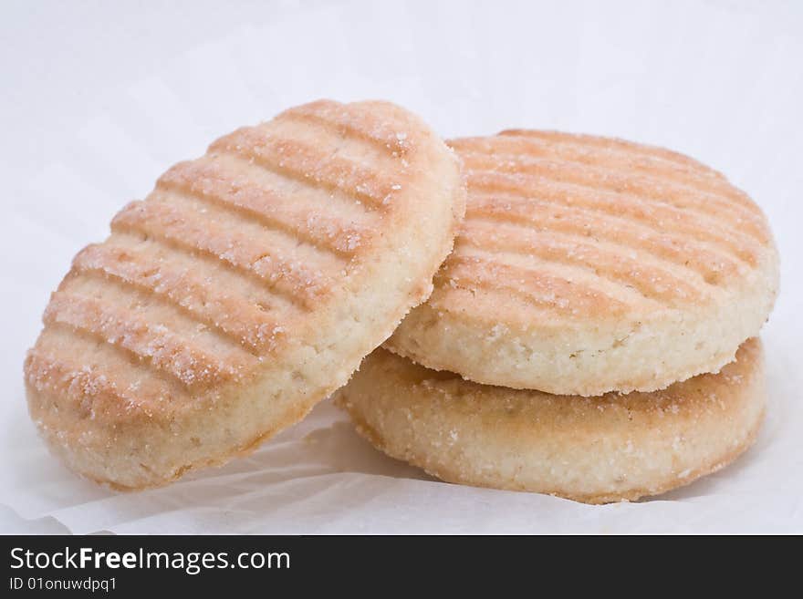 Three delicious cookies on the white paper