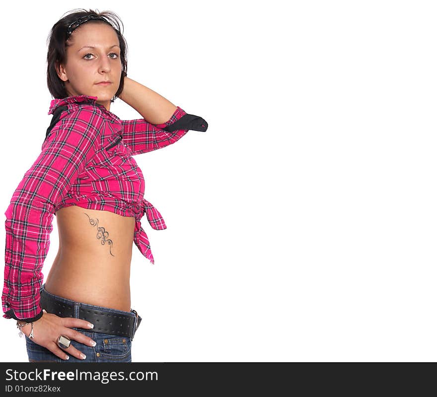 Portrait of a young woman wearing a pink shirt and ripped blue jeans. She is showing off her beautiful tattoo. Isolated over white. Portrait of a young woman wearing a pink shirt and ripped blue jeans. She is showing off her beautiful tattoo. Isolated over white.