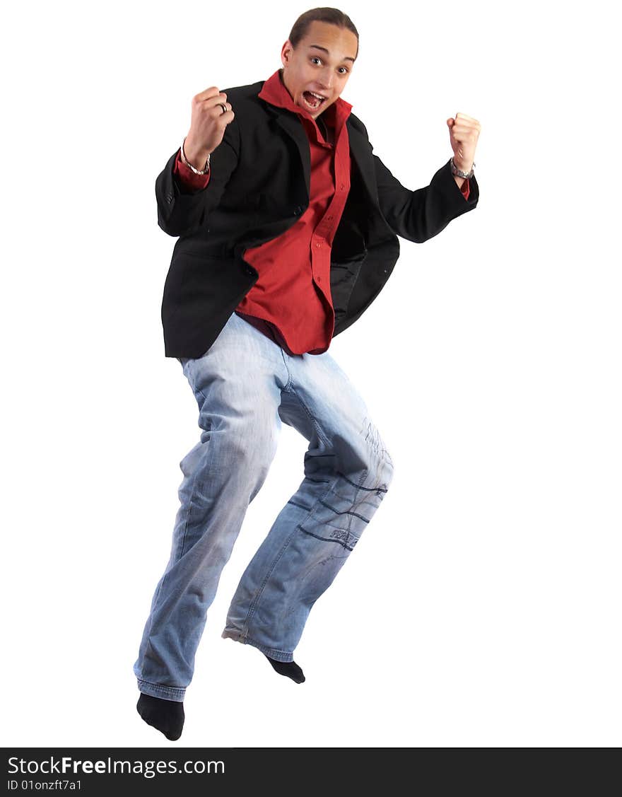 A young businessman with a red shirt - a jacket and blue jeans is jumping in joy. Isolated over white. Slight motion bluriness is intended. A young businessman with a red shirt - a jacket and blue jeans is jumping in joy. Isolated over white. Slight motion bluriness is intended.