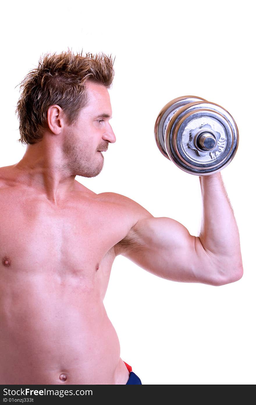 Bodybuilder makes workout with silver barbell. Bodybuilder makes workout with silver barbell