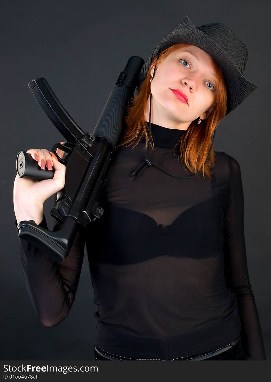 Young woman holding the gun