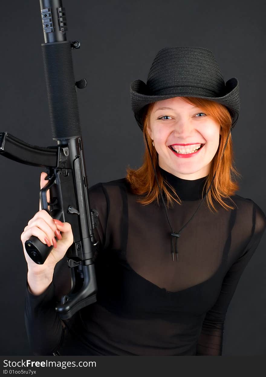 Young woman holding the gun