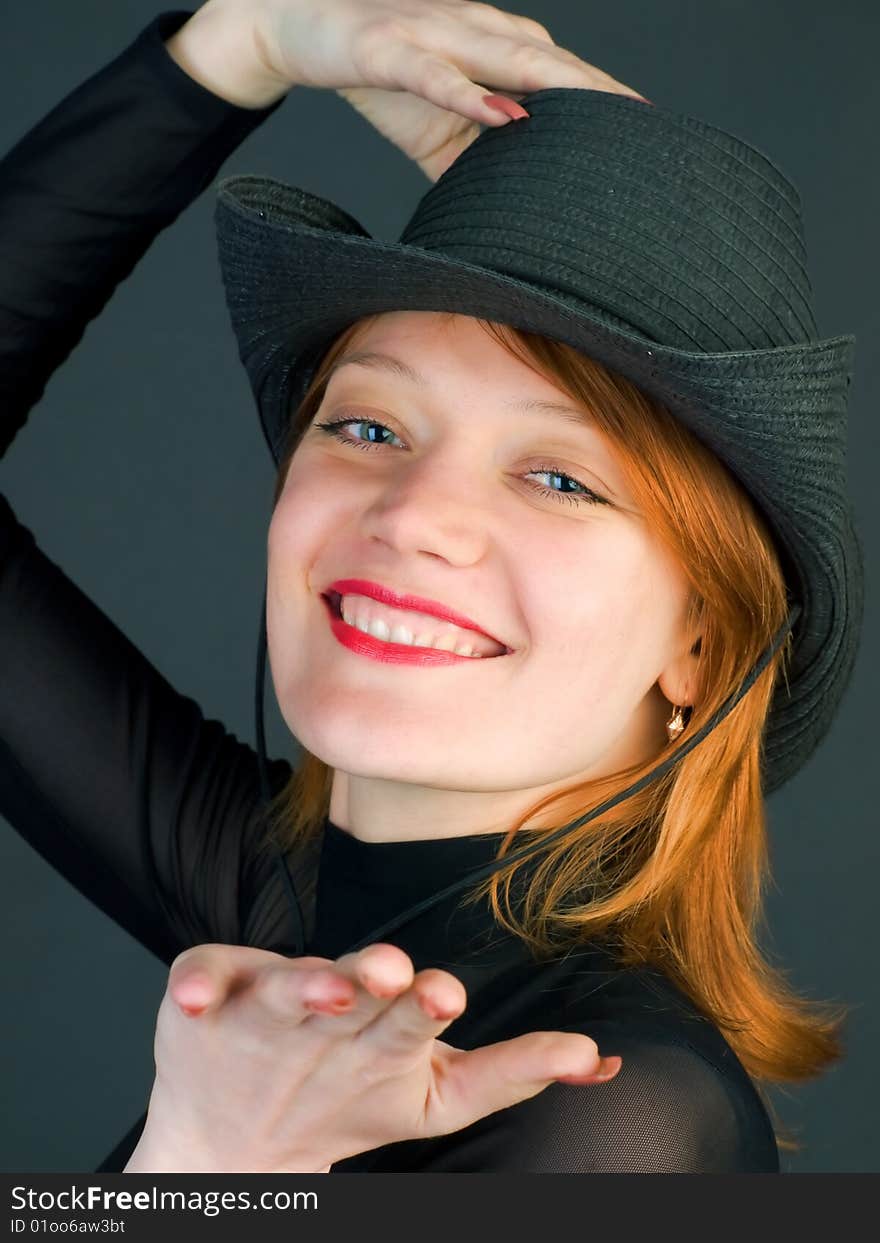 Sexy red young woman wearing a cowboy hat. Sexy red young woman wearing a cowboy hat