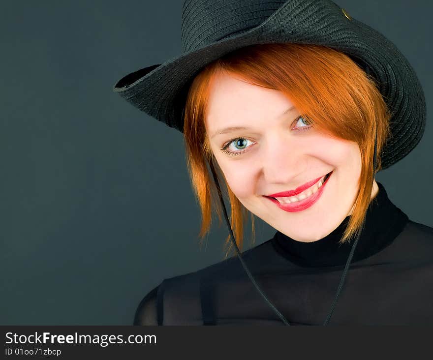 Sexy red young woman wearing a cowboy hat. Sexy red young woman wearing a cowboy hat