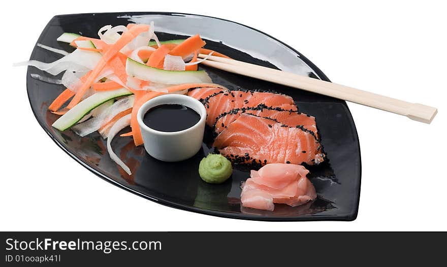 Japanese inspired salmon on a black plate