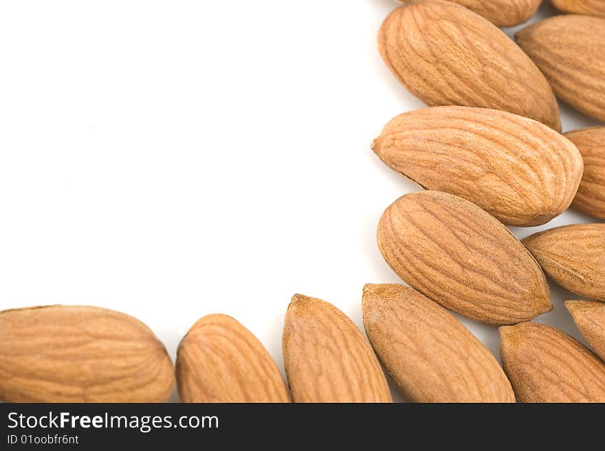 Almond nuts forming a frame, in white background. Almond nuts forming a frame, in white background.