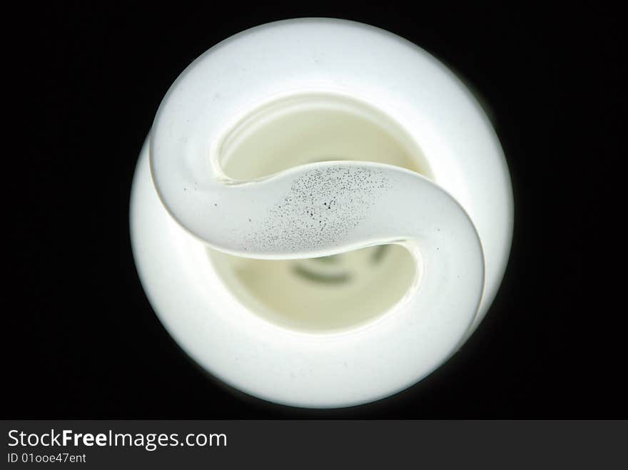 Light bulb on black background