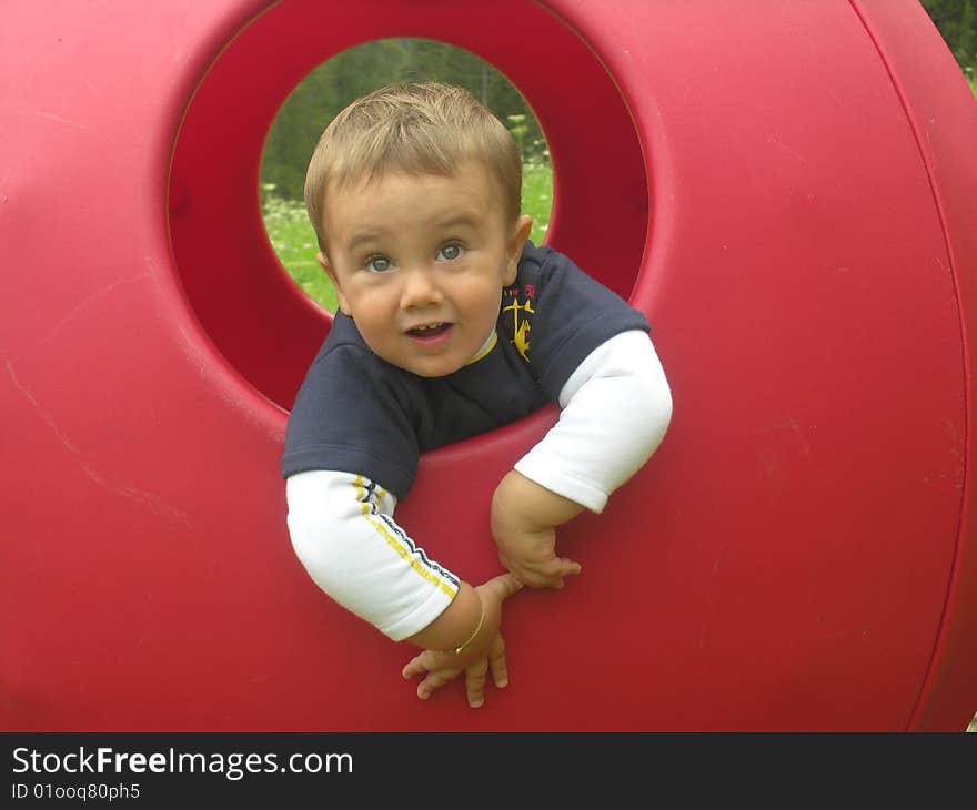 A baby in a red hole. A baby in a red hole