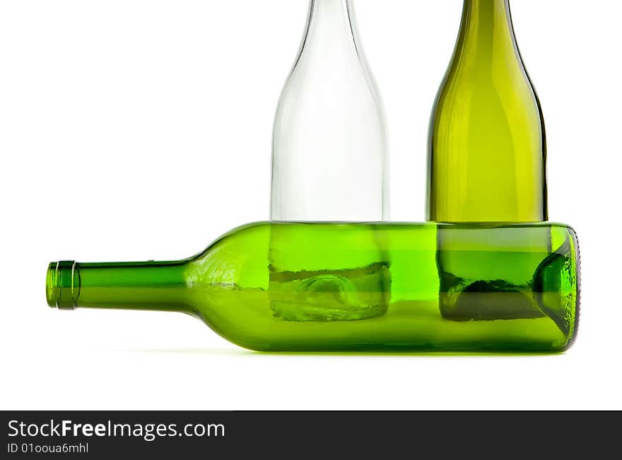 Green empty bottles on white