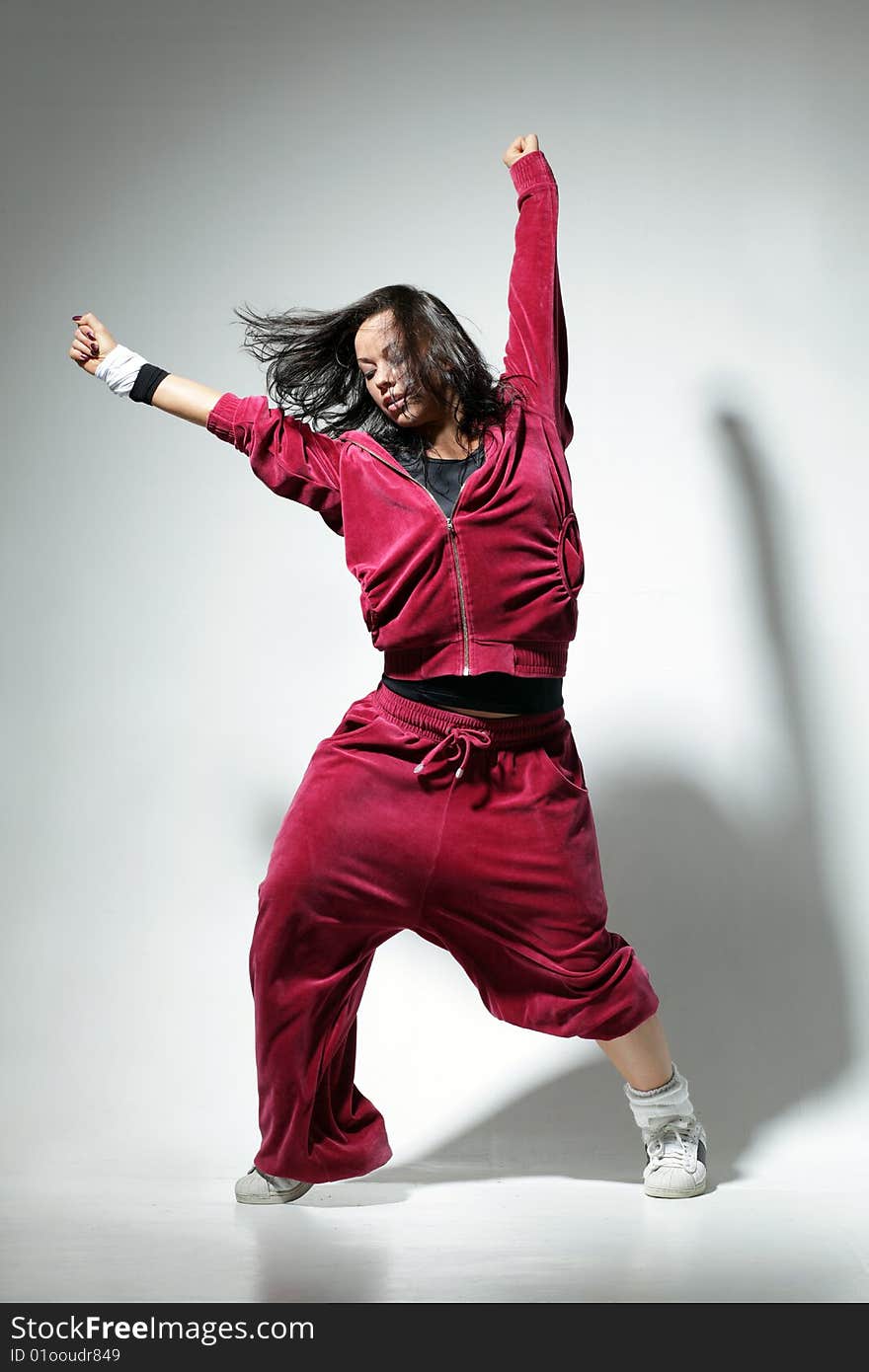 Modern style dancer posing on studio background. Modern style dancer posing on studio background