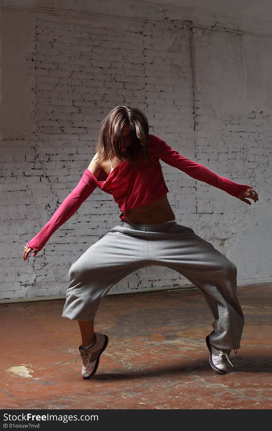 Modern style dancer posing on studio background. Modern style dancer posing on studio background