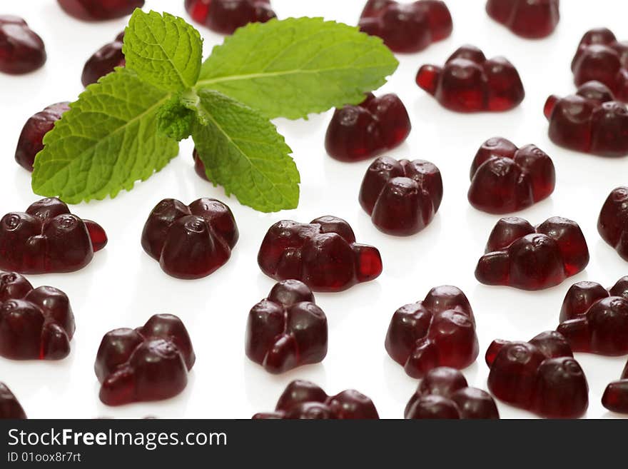 Brightly coloured wine gums on bright background