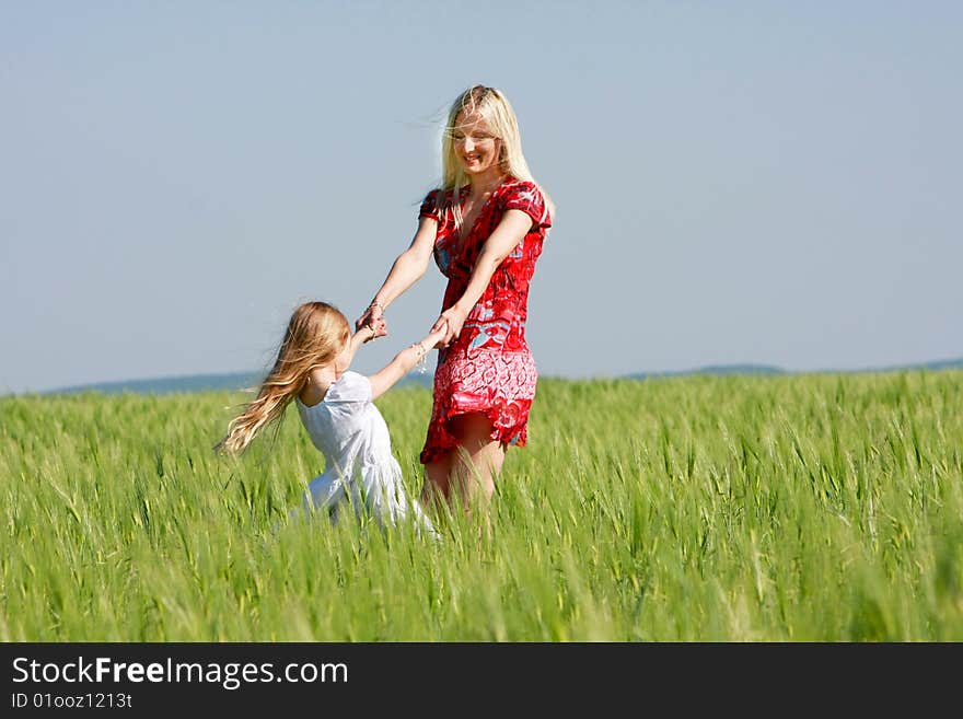 Happy mother and daughter outdoors