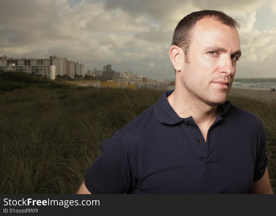 Handsome young man in the sand dunes. Handsome young man in the sand dunes