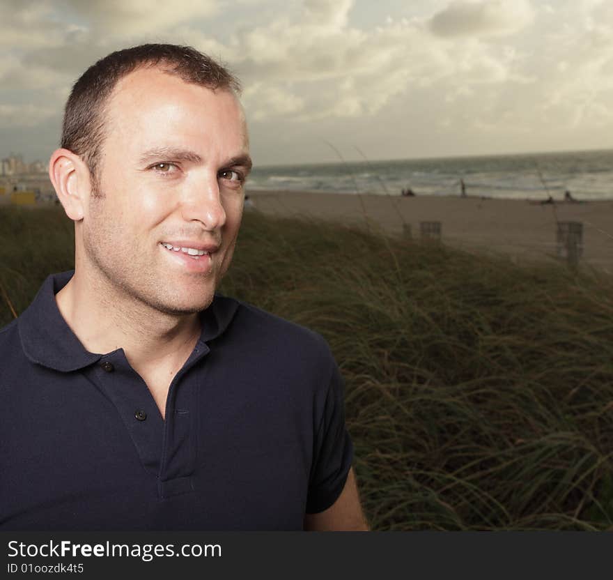 Handsome young man in the sand dunes. Handsome young man in the sand dunes