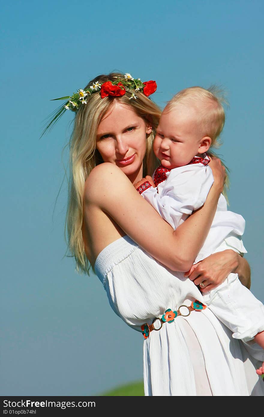 Loving mother and son in traditional clothes