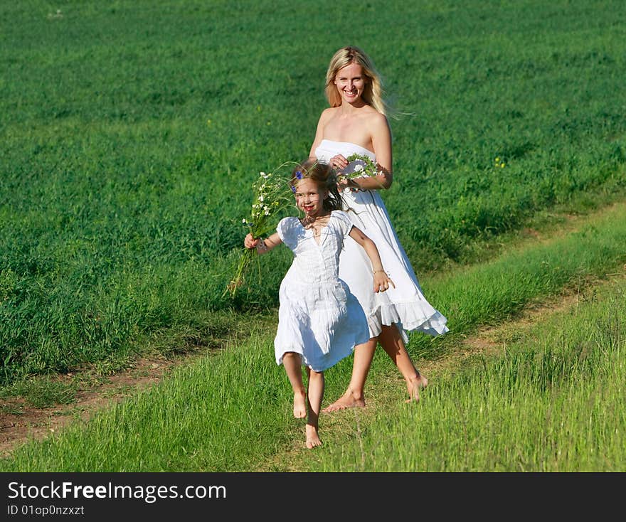 Mother And Daughter On Rural Road