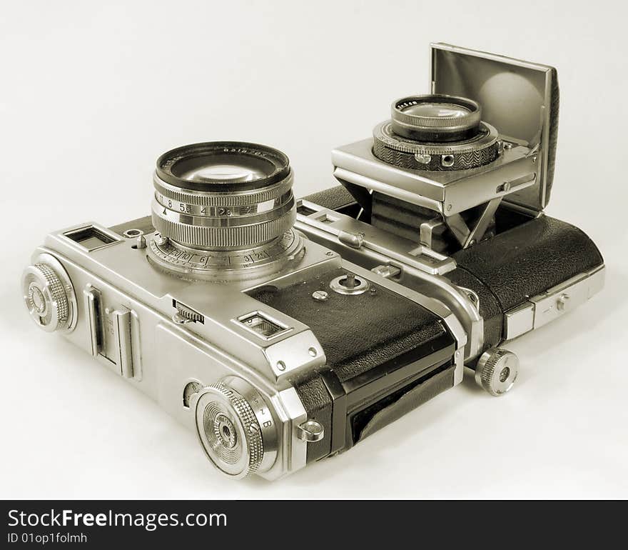 Two antiquarian 35-mm film cameras.