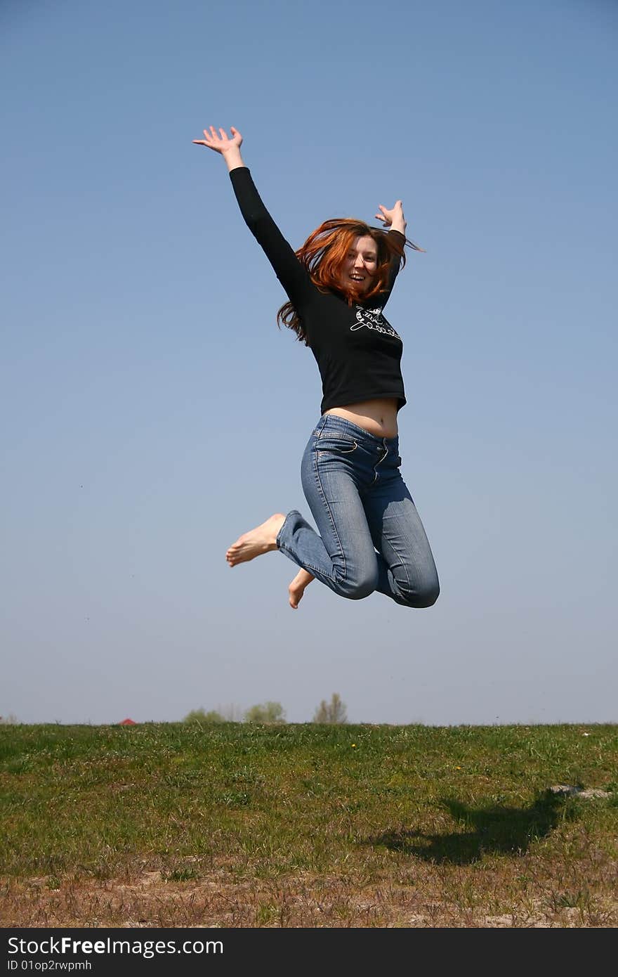 The girl taken in a jump like hanging in the air. The girl taken in a jump like hanging in the air