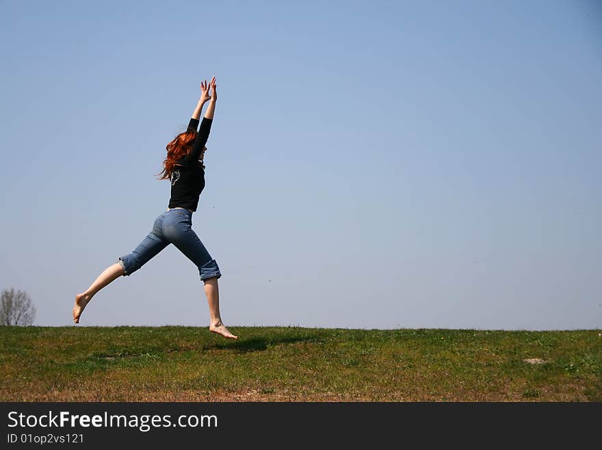 The girl taken in a jump like hanging in the air. The girl taken in a jump like hanging in the air