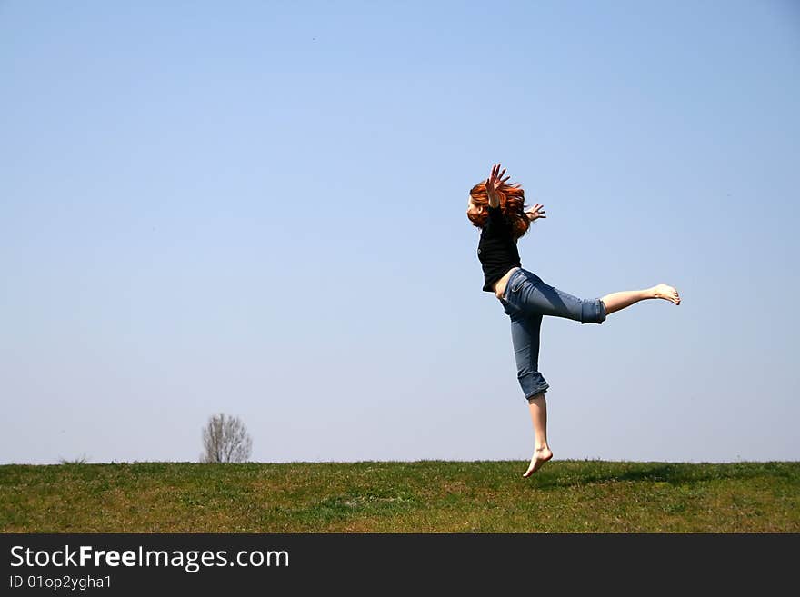 The girl taken in a jump like hanging in the air. The girl taken in a jump like hanging in the air