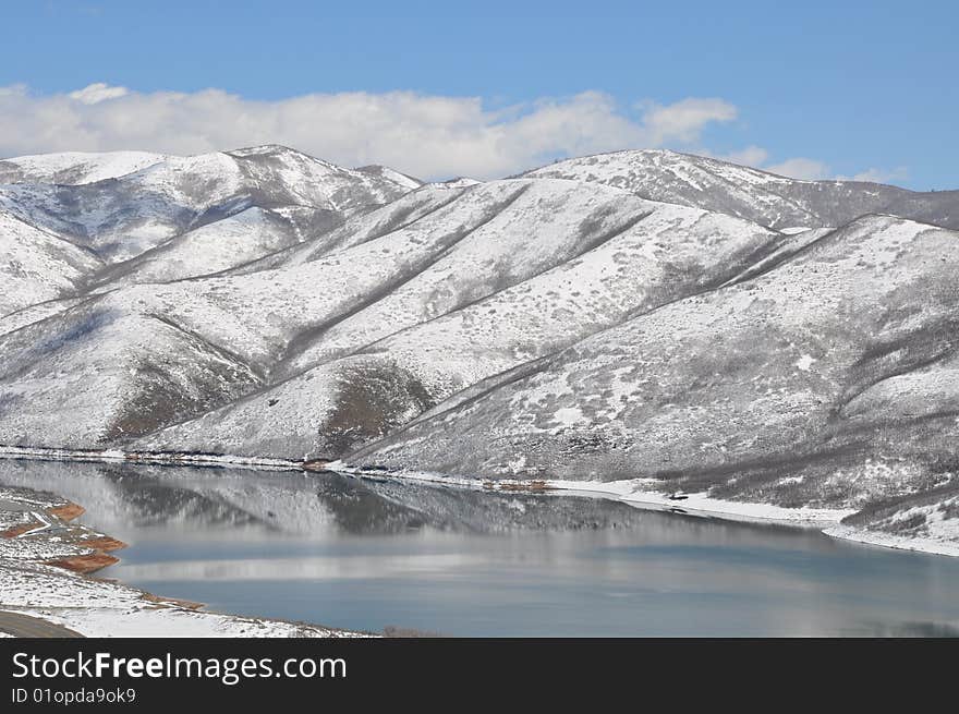 This is a Photo of a lake in Utah in spring time. you can see where the ice is still melting off the lake. This is a Photo of a lake in Utah in spring time. you can see where the ice is still melting off the lake