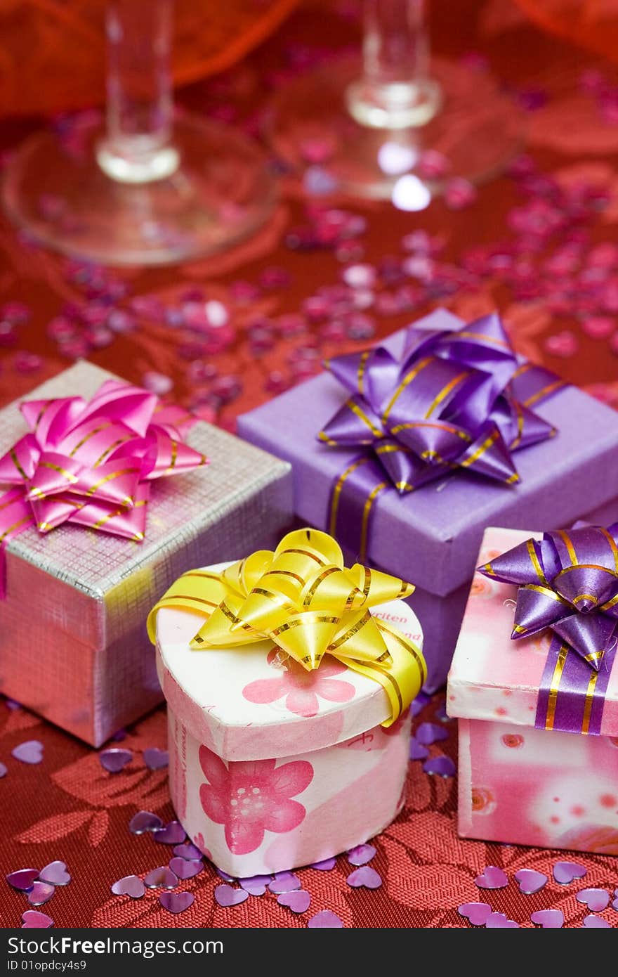 Gift boxes with hearts and glass