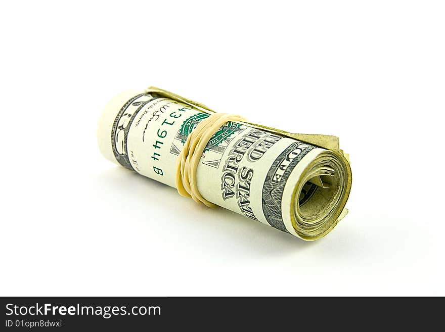 Roll of single dollar bills with elastic band on a white background. Roll of single dollar bills with elastic band on a white background