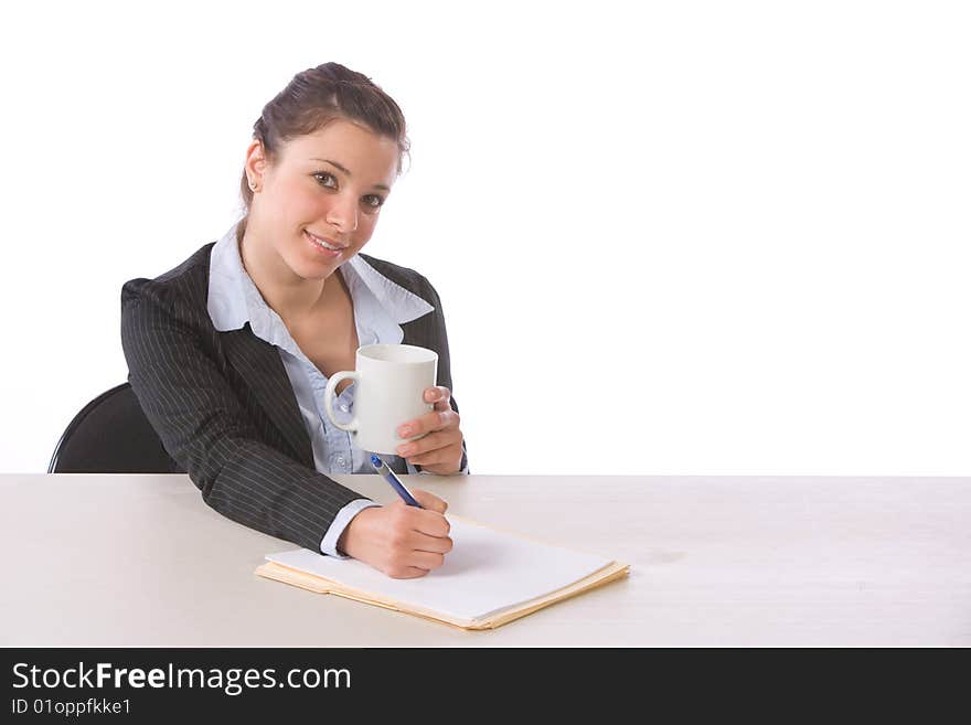 Business Woman Writing Notes At Desk