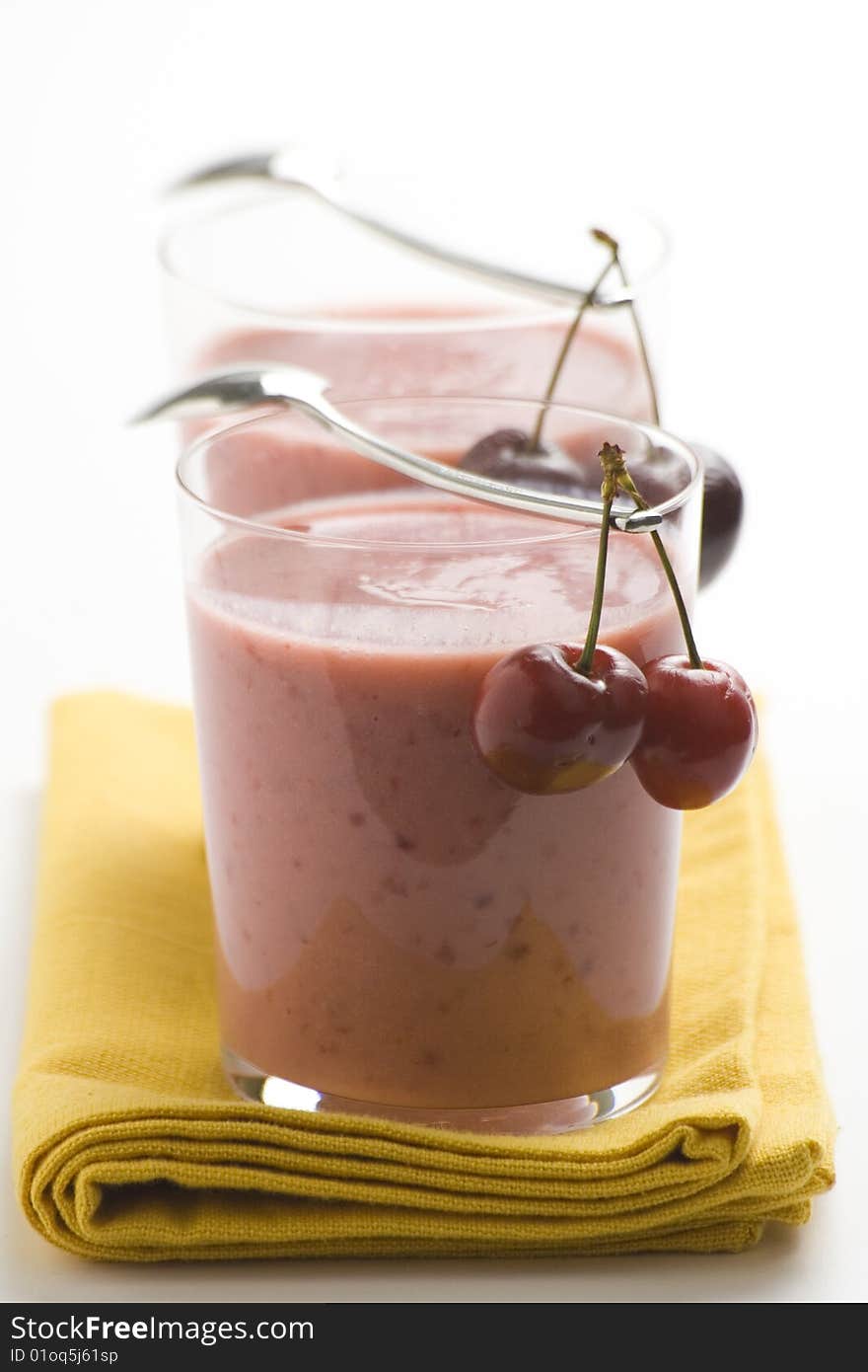 A delicious cherry milkshake isolated over white