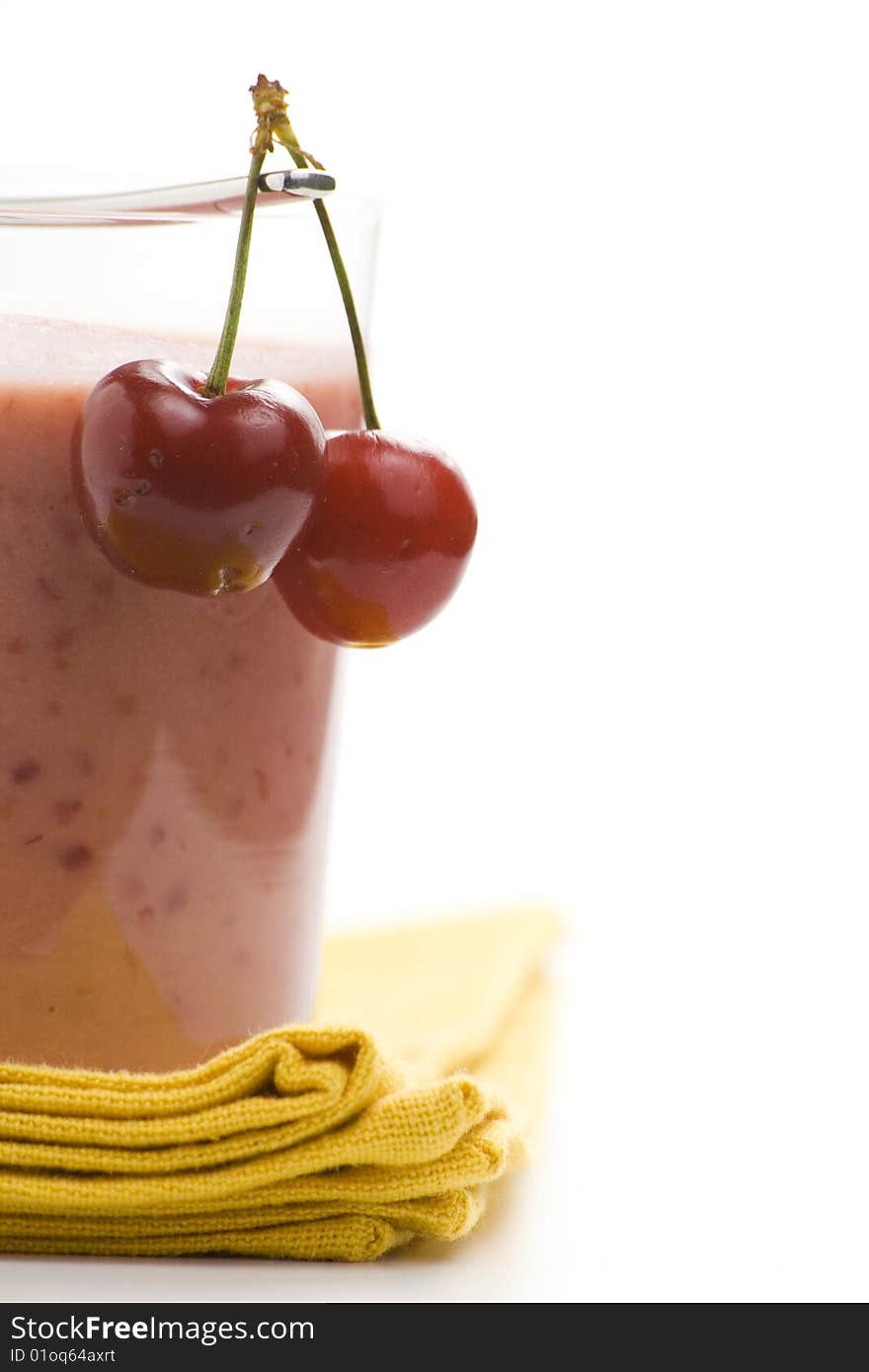 A delicious cherry milkshake isolated over white