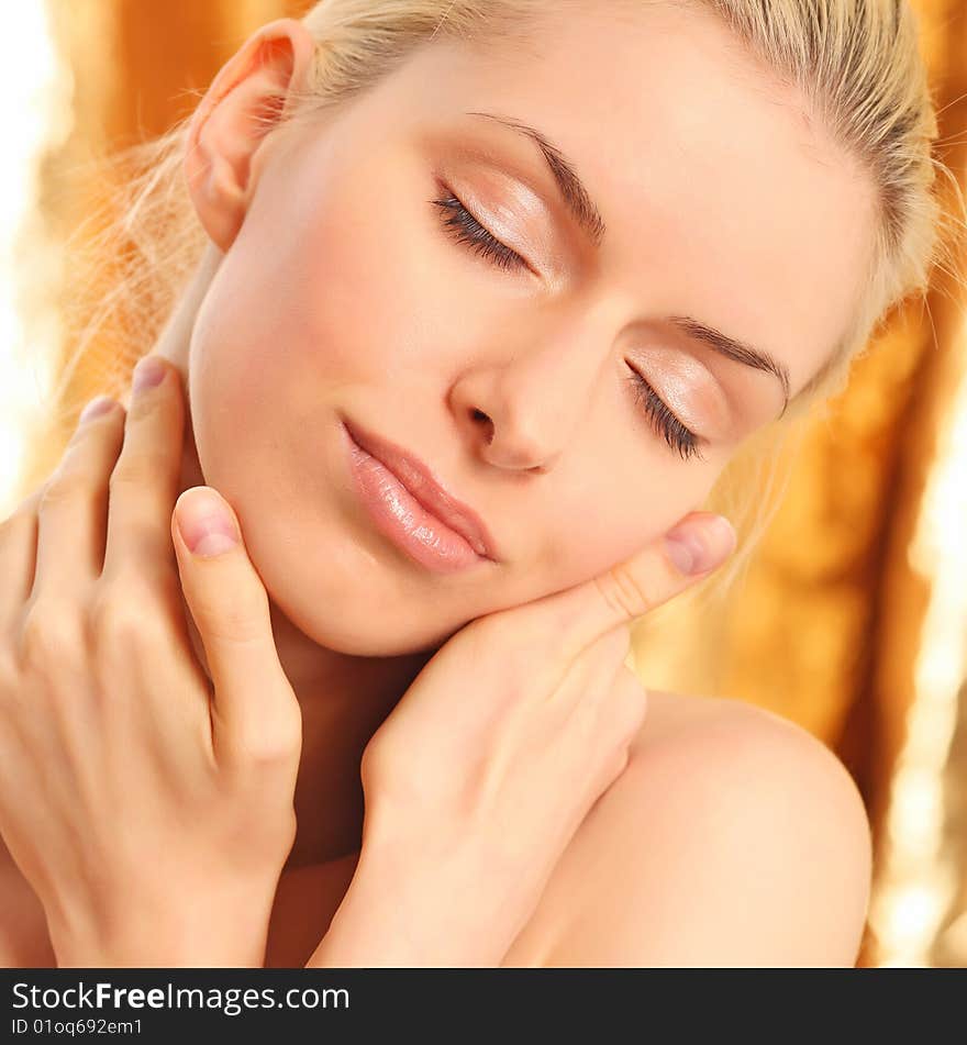 Portrait of the young beautiful woman close up