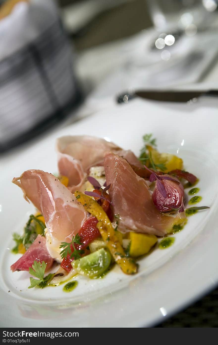 Prosciutto salad with beets, stewed peppers and a poached egg.