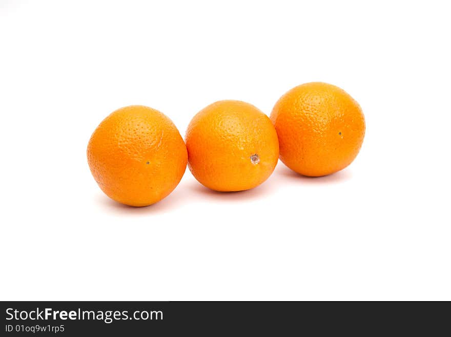 Three oranges isolated on white