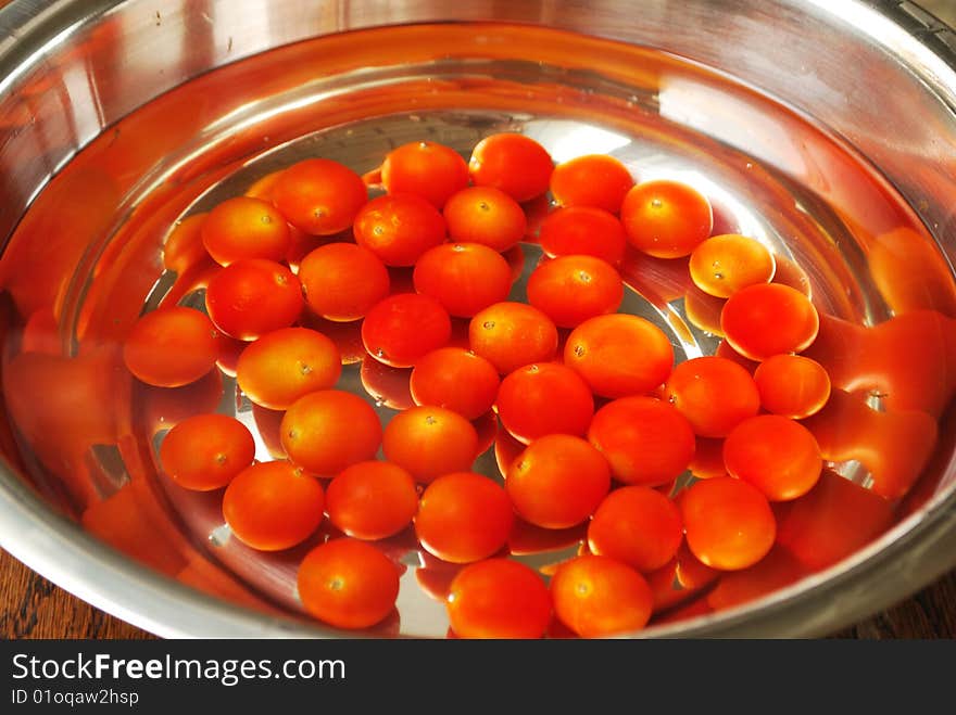 Tomatoes cherry in cold water. Tomatoes cherry in cold water